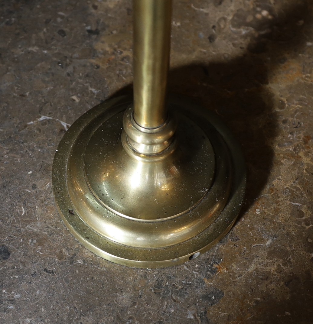 A 1930s English brass adjustable desk lamp, with flexible stem and scalloped shaped shade, height 58cm